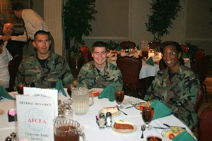 After the April chapter ROTC scholarships presentation, chapter members gather to chat, including (l-r) Col. Jim Strawn, USAF; Cadet Susan Collins; Cadet Ashley Bower; and Lt. Col. Kyna McCall, USAF, chapter vice president for special projects. 